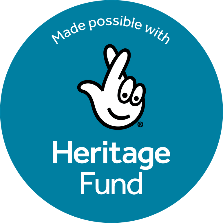 Teal coloured circular logo with the words Made Possible wth Heritage Fund displayed along with an image of a hand with its fingers crossed for good luck
